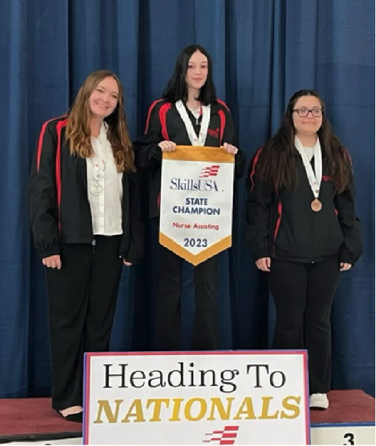  3 girls receiving awards 
